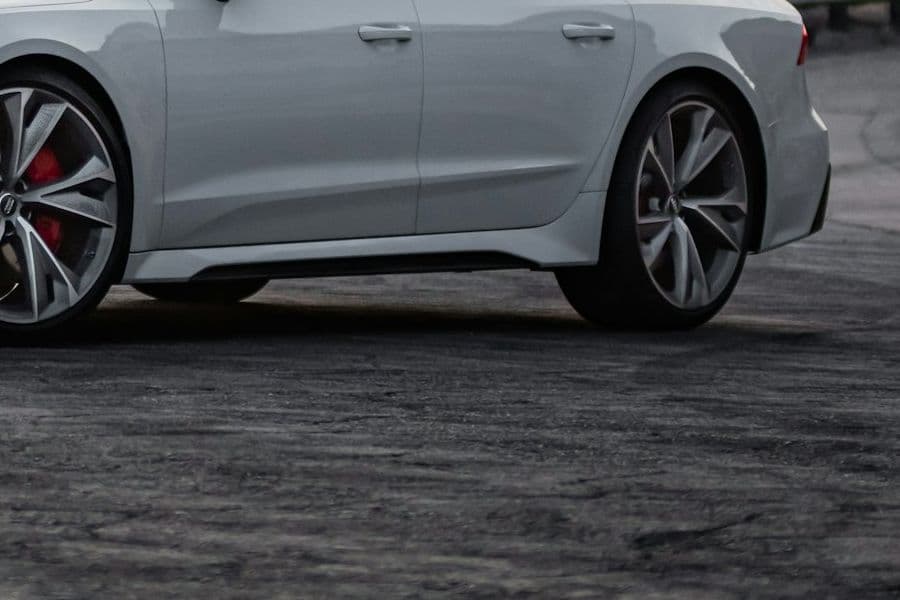 Side detail of the silver Audi RS 7 wheels and flared arches