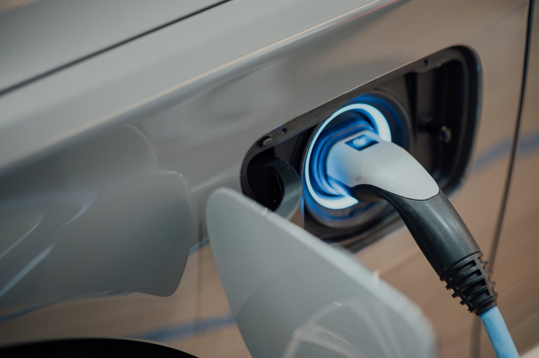 Charging connector plugged into an electric car's charging port